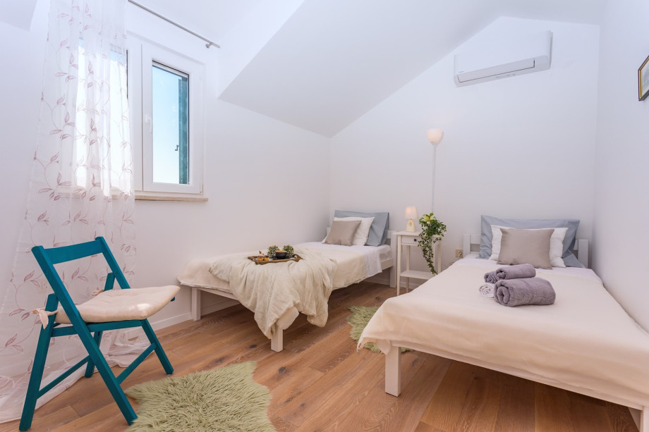 A Bedroom No2 with two single beds 90cm x 200cm, AC