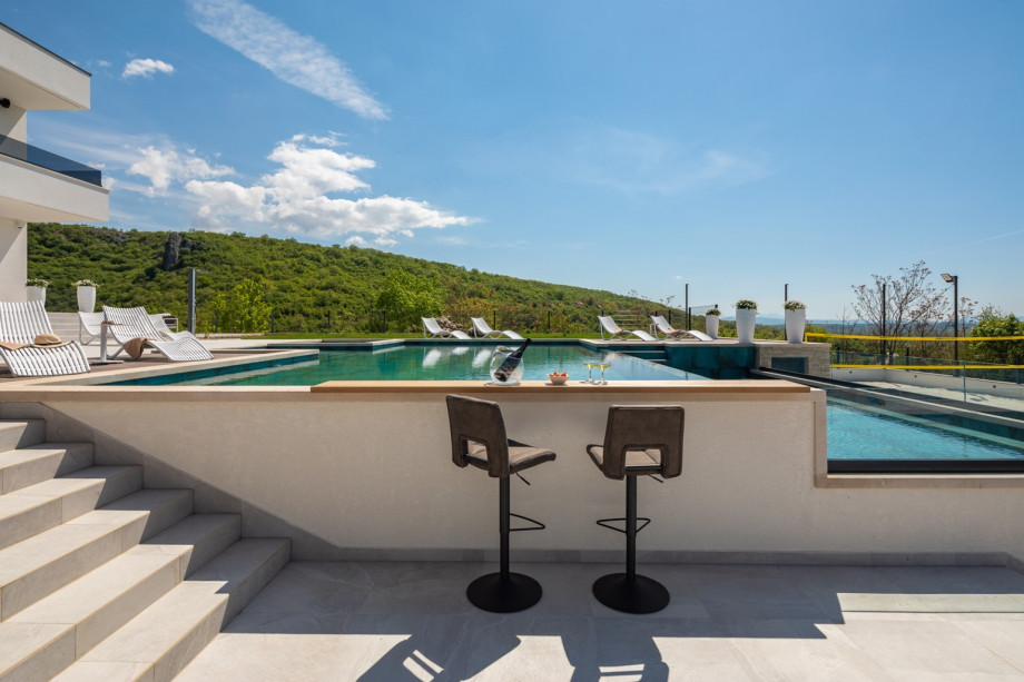 One of the few lounge areas near the outstanding pool, with panoramic views of the unspoiled nature