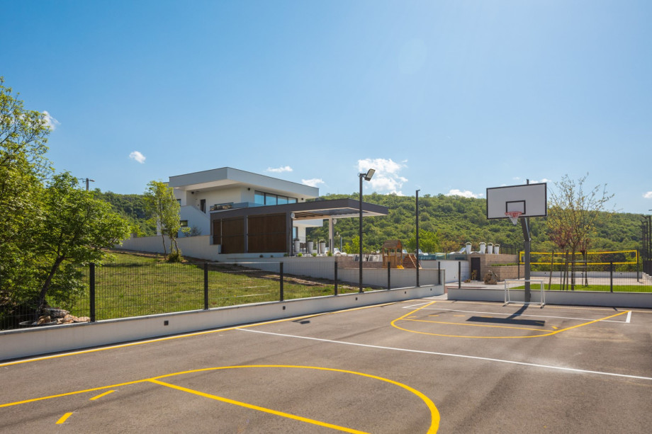 A basketball court and a volleyball sand court for showing your sports skills