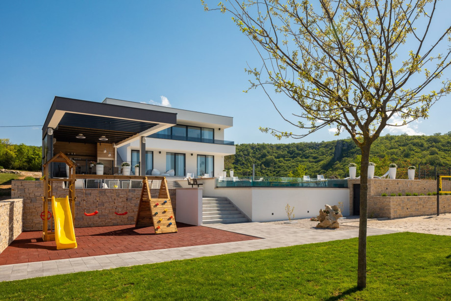 The children's playground with a wooden house