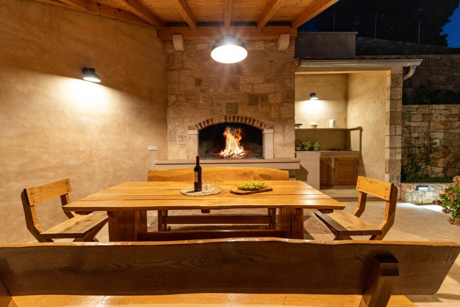A summer kitchen with a traditional barbecue.