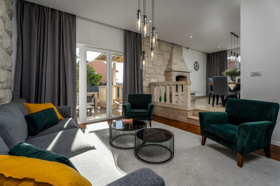 Living room with a sofa that can convert into a sofa bed, a flat screen TV, Netflix, and a PS4 for your youngest.