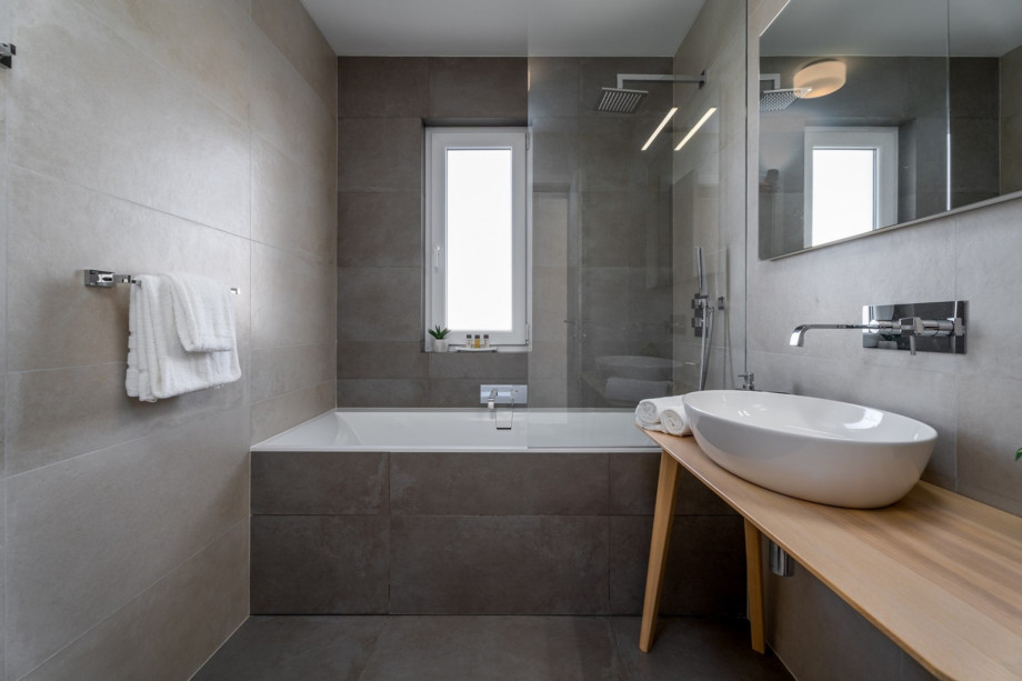 Family bathroom with a bathtub.