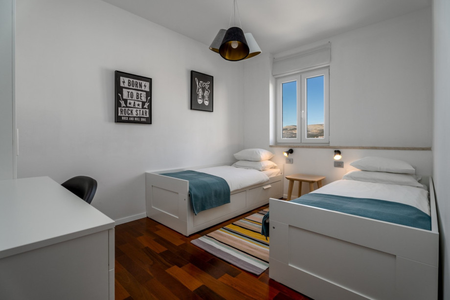 Bedroom No3 (11sqm) with two single beds 80cm x 200cm.