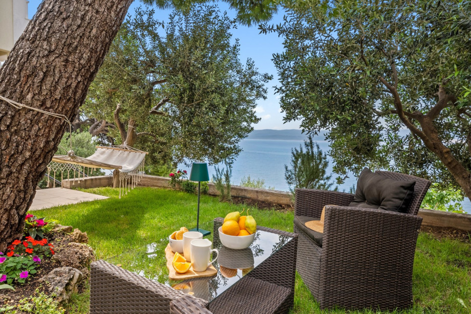 The outdoor area offers a private, heated swimming pool 5,2m x 3 m, 6 sun deck chairs, and an outdoor shower.