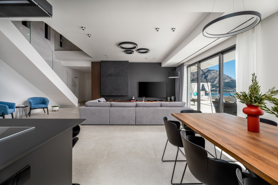 Villa Andoris offer floor-to-ceiling glazing doors toward the pool area.