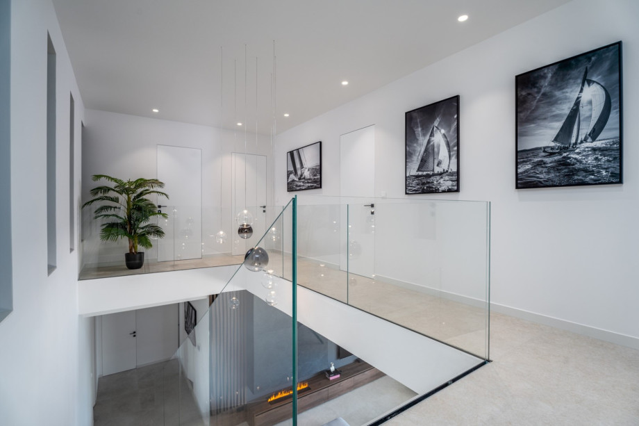 Villa Andoris offers an indoor staircase at the bedroom level on the first floor, downstairs to the living/pool area (ground floor level).