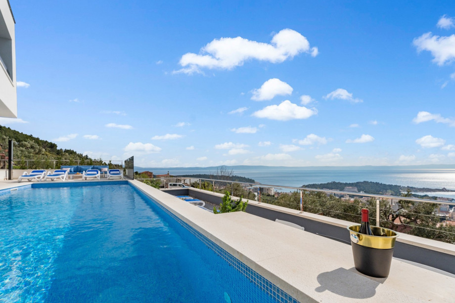 The outdoor area also offers a sun deck area with 8 deck chairs, an outdoor shower, a lounge corner