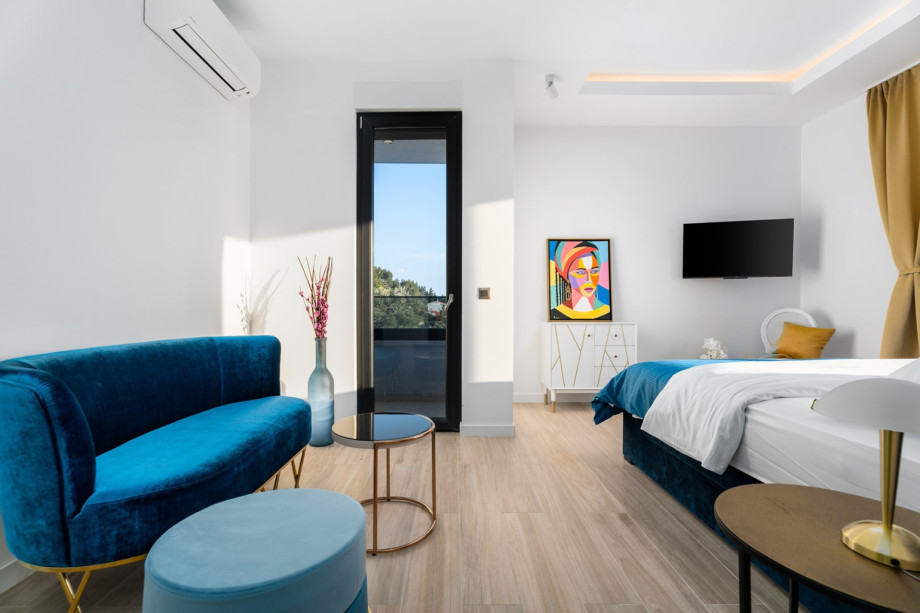 Bedroom No. 4 with a comfortable sofa, for your relaxing time.