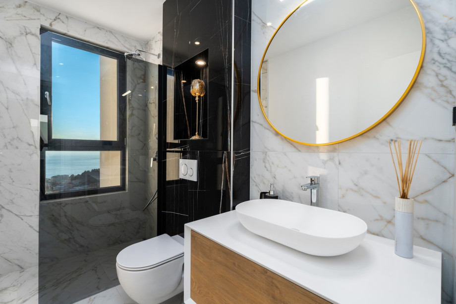 En-suite bathroom with a shower, and amazing sea views.
