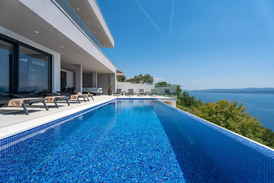 A private and heated, infinity swimming pool 9m x 3m, the water is with a no-Chlorine system, and it has a hydro massage