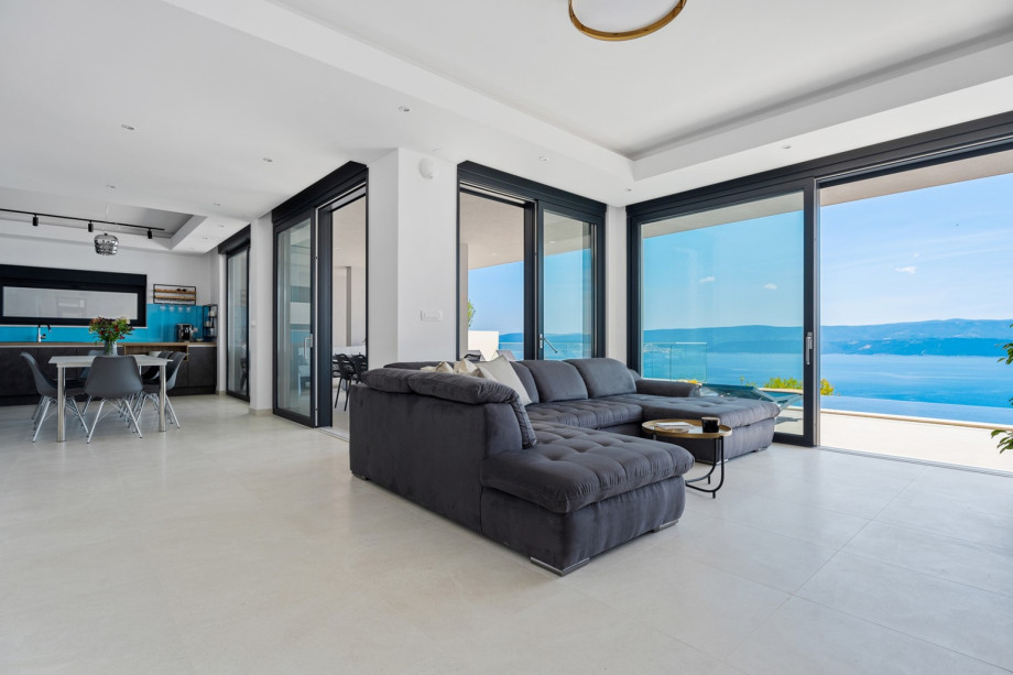 Villa Admira Maria offers floor-to-ceiling glazing doors toward the pool area.