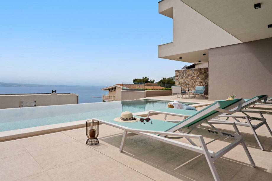 Sun deck area with 6 sun deck chairs and an amazing view