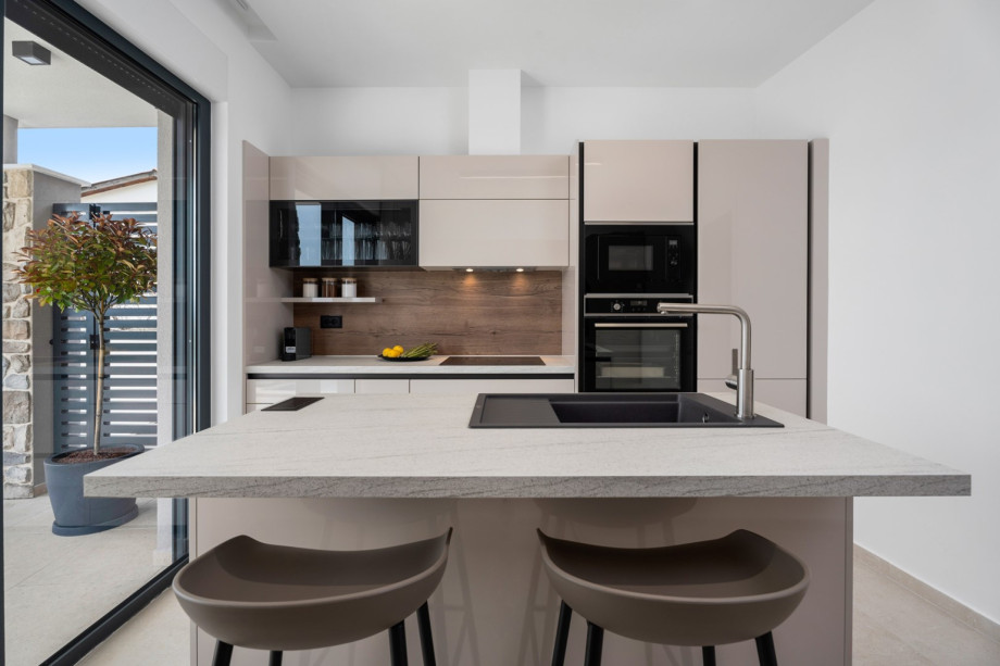 The kitchen island has all the amenities a modern guest needs.