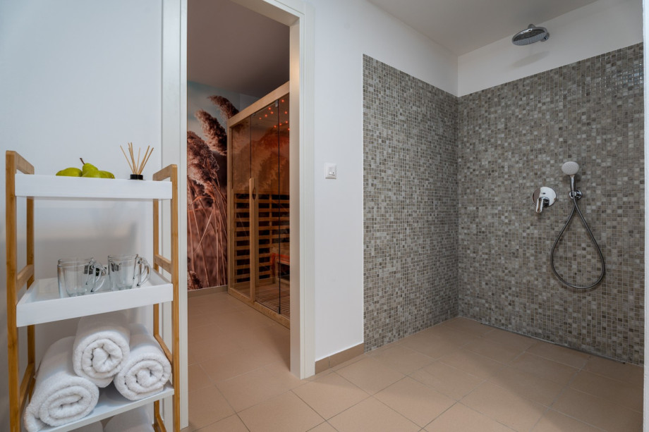 Next to the play zone is a shower, and a separate toilet.