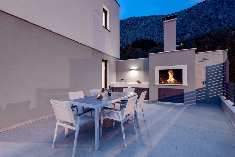 The barbecue is next to the  dining area