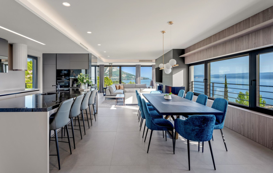 A fully equipped kitchen with a dining table for 8 people
