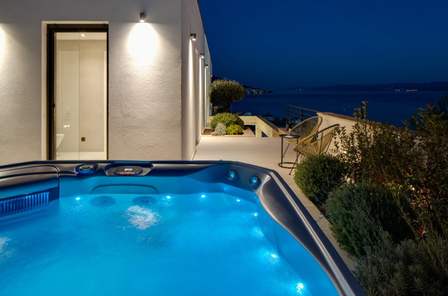 The outdoor area offers a sun deck with a sea view, a private pool of 28.5 m2, and whirlpool