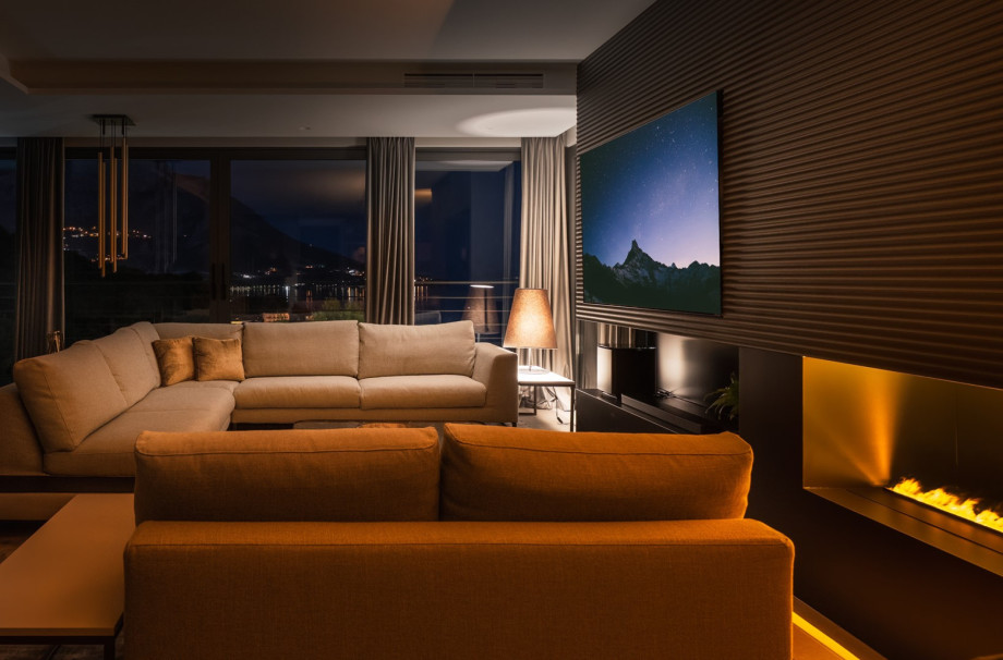 Very comfortable living area with a flat-screen TV, A/C, an Electric Steam Fireplace