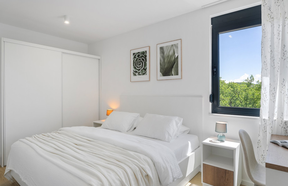 Bedroom NO2 (12 sqm) has an air-conditioned, TV, a king-size bed measuring 180 cm by 200 cm