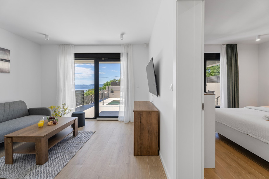 The second living room on the ground floor features a sofa that can be turned into a sofa bed