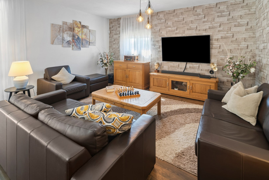 Step into the inviting living space, where modern comfort meets rustic charm.