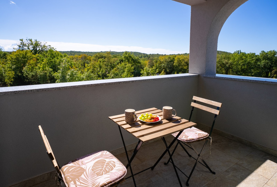 Access to balconies that invite you to soak in the picturesque views of the lush countryside.