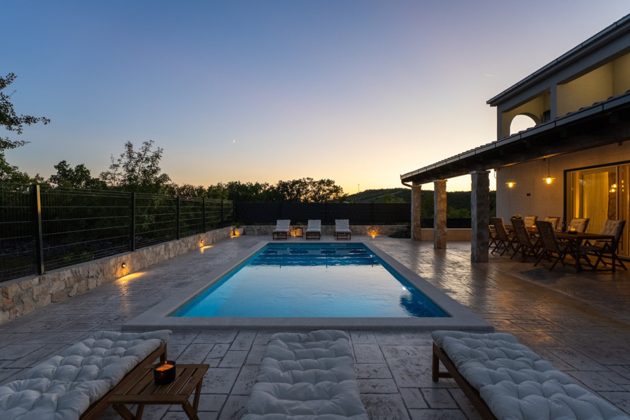 Enjoy the peaceful night outdoors, relaxing on the seating