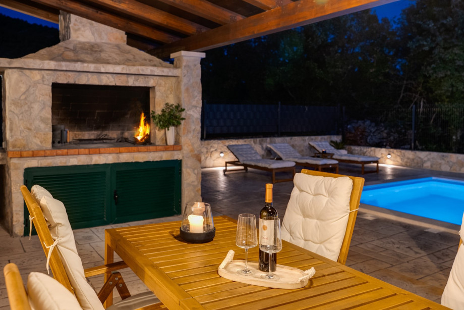 The barbecue area, equipped for wood or charcoal cooking, allows for delightful grill-outs under the stars.