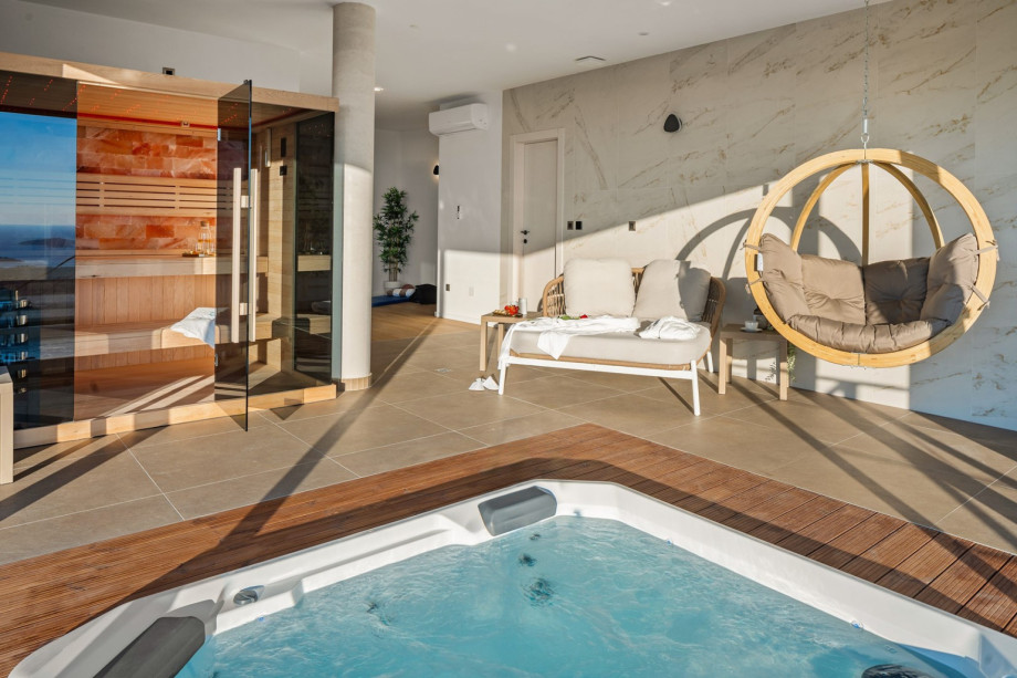 A 29sqm wellness area with a Finnish sauna and a Whirlpool (hot tub) overlooking the pool and islands