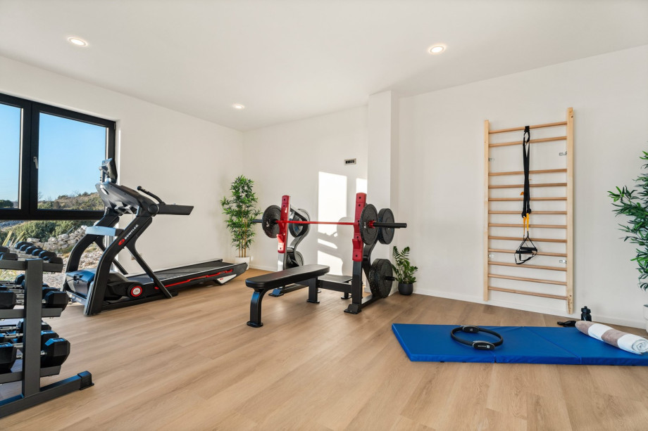 you have a spa area that offers a gym, sauna, and massage tub. A 28sqm Gym offering a multifunctional device, an exercise bike, and pilates equipment
