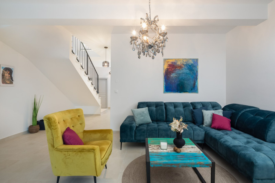 The expansive 50sqm living area boasts a cozy living room