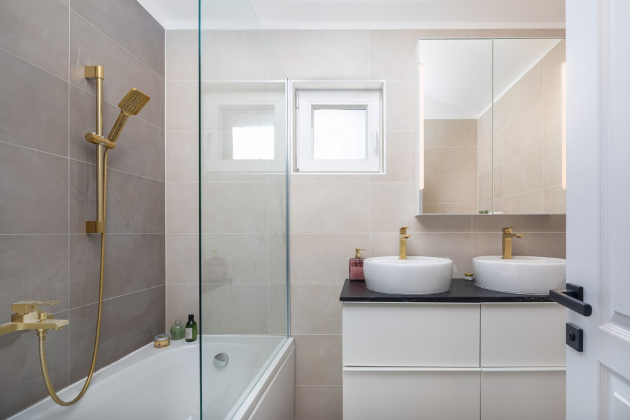 An en-suite bathroom with a luxurious bathtub
