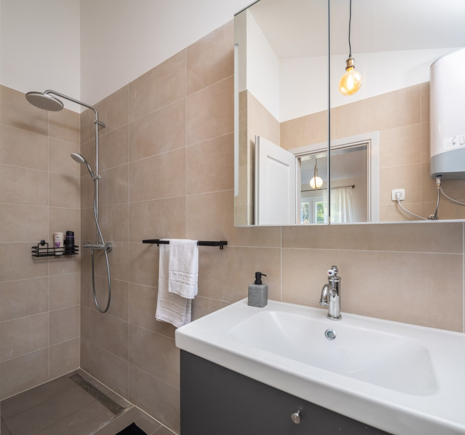 An en-suite bathroom with a shower