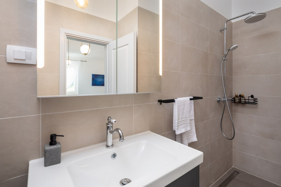 An en-suite bathroom with a shower