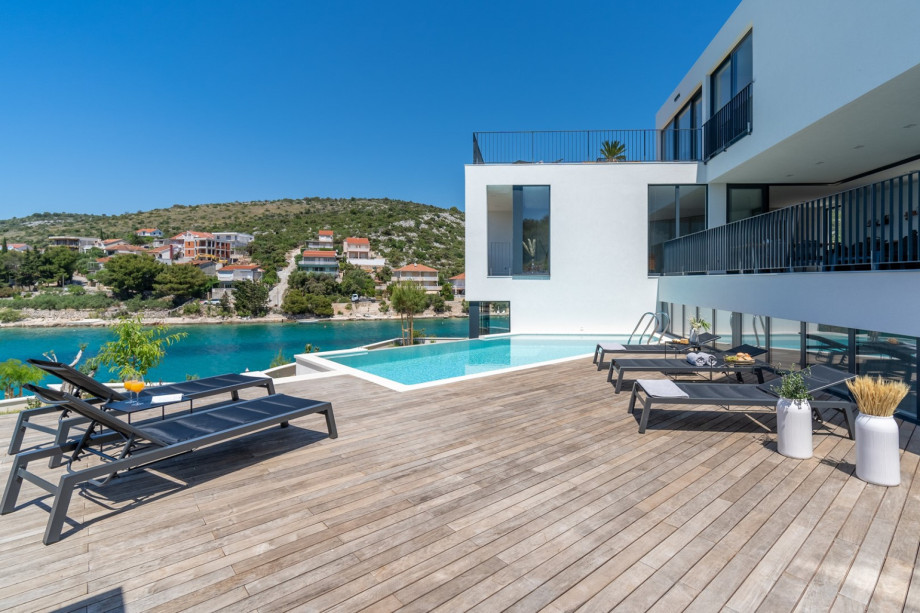 From the covered private parking lot that can take 3 cars, + 2 places on a private open plot