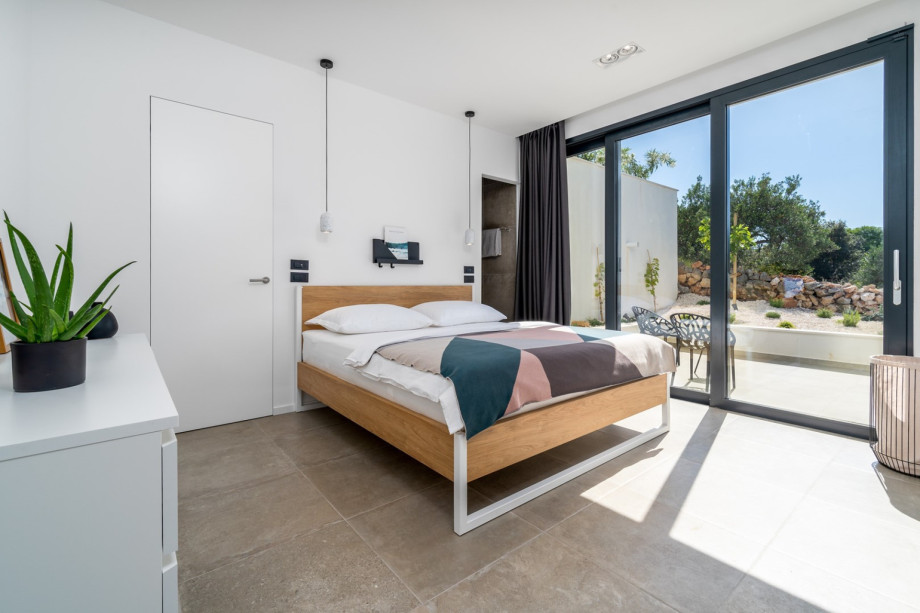 Bedroom No1 with a king size bed 180cm x 200cm, en-suite bathroom with a shower, and a terrace