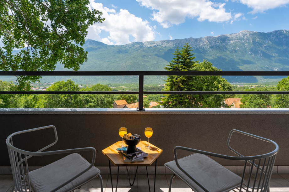 A balcony with outdoor furniture, and shared with Bedroom No3 and No4