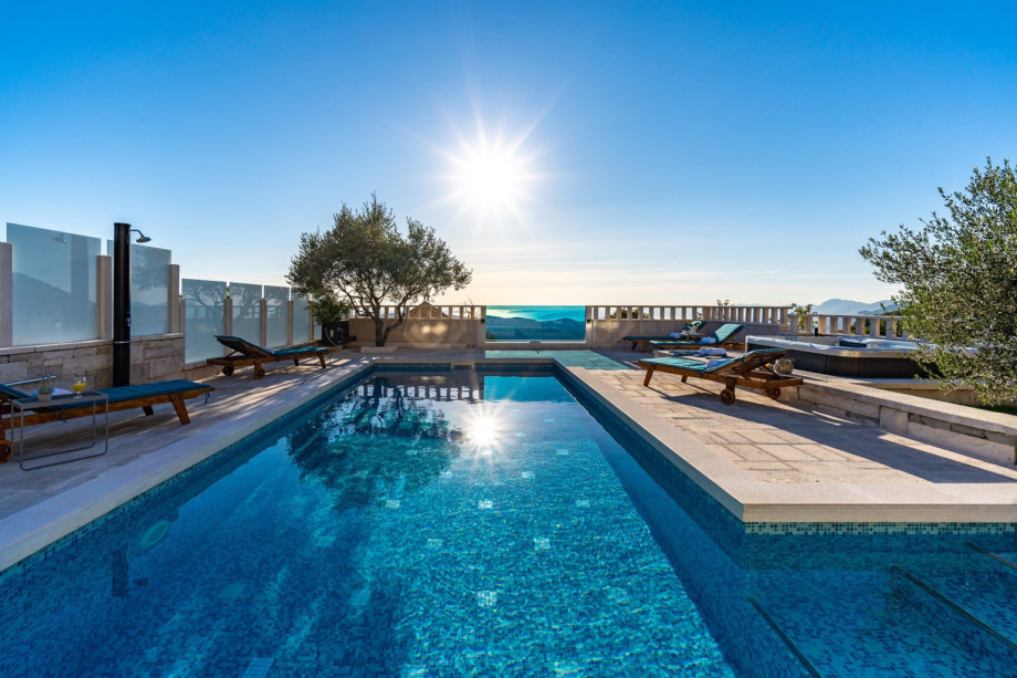 A private and heated 36 sqm swimming pool with a Hot Tub next to it