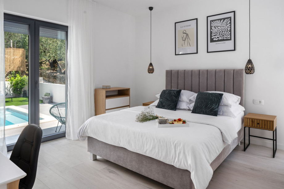 Bedroom NO1 (16sqm) with glass door toward the pool area, A/C, a TV, queen size bed 160cm x 200cm, en-suite bathroom with a shower