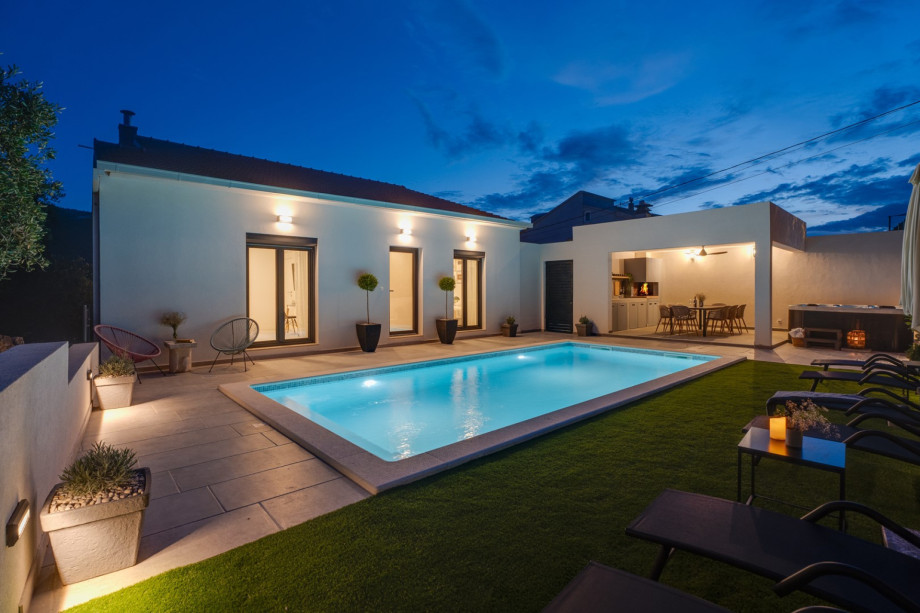 Adjacent to the pool, a relaxing Whirlpool (Hot Tub) awaits, offering the ultimate in relaxation