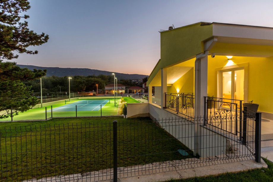 View from the summer kitchen area toward tennis court