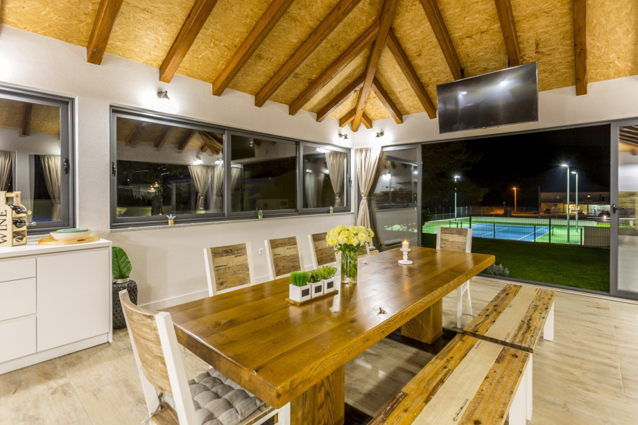 Dining area with a fully equipped kitchen with exit to the pool area,