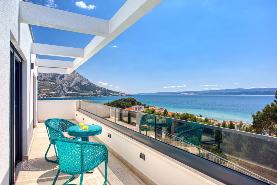 A Bedroom No3 also offers a balcony with a sea view