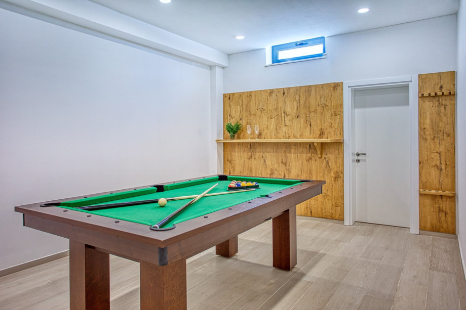 You can enjoy yourself in a room with a Billiard (a Pool table) and darts