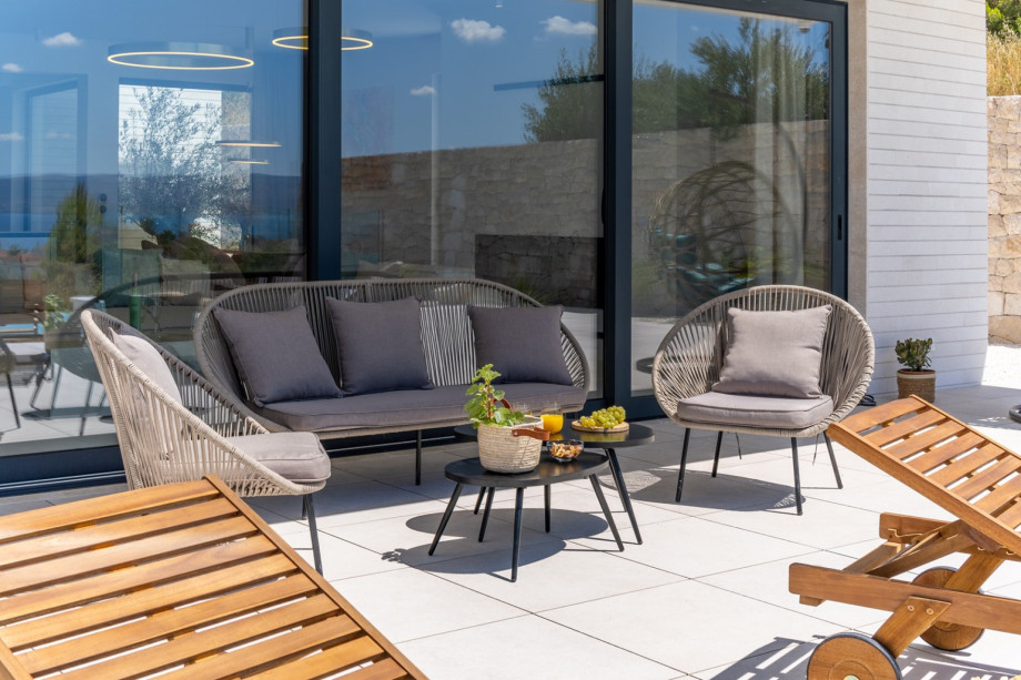 Lounge furniture next to the pool