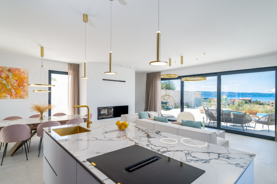 A kitchen is equipped with a modern kitchen island