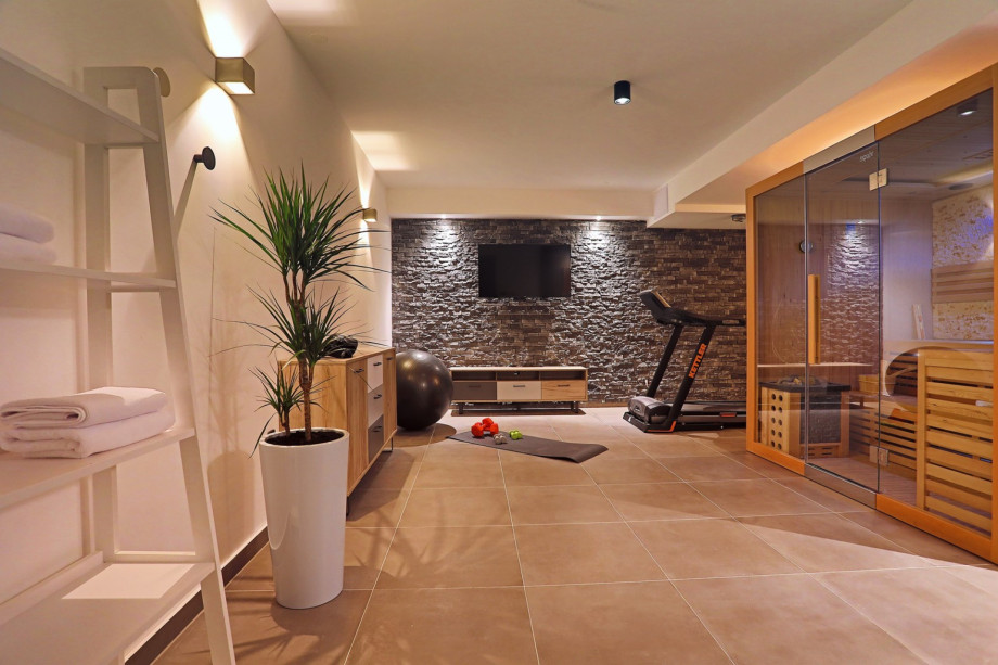 The lower ground floor offers a Gym with a Treadmill, a punching bag, weights, a yoga ball.