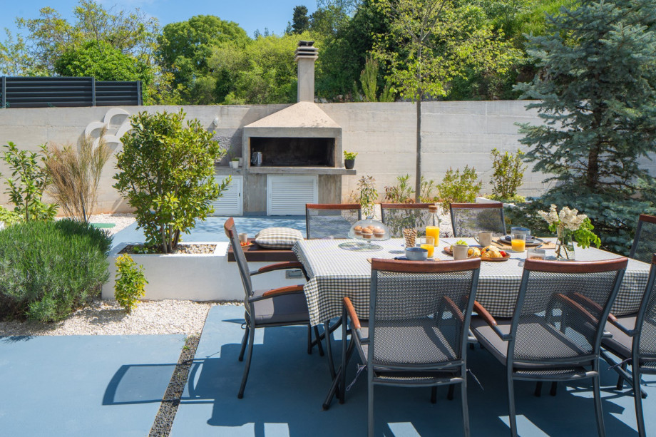 Open-air dining area with a fully equipped barbecue, ideal for alfresco dining with friends and family