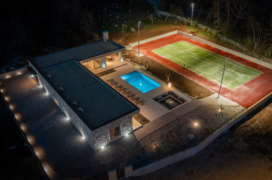 For those looking to stay active, a private tennis court awaits